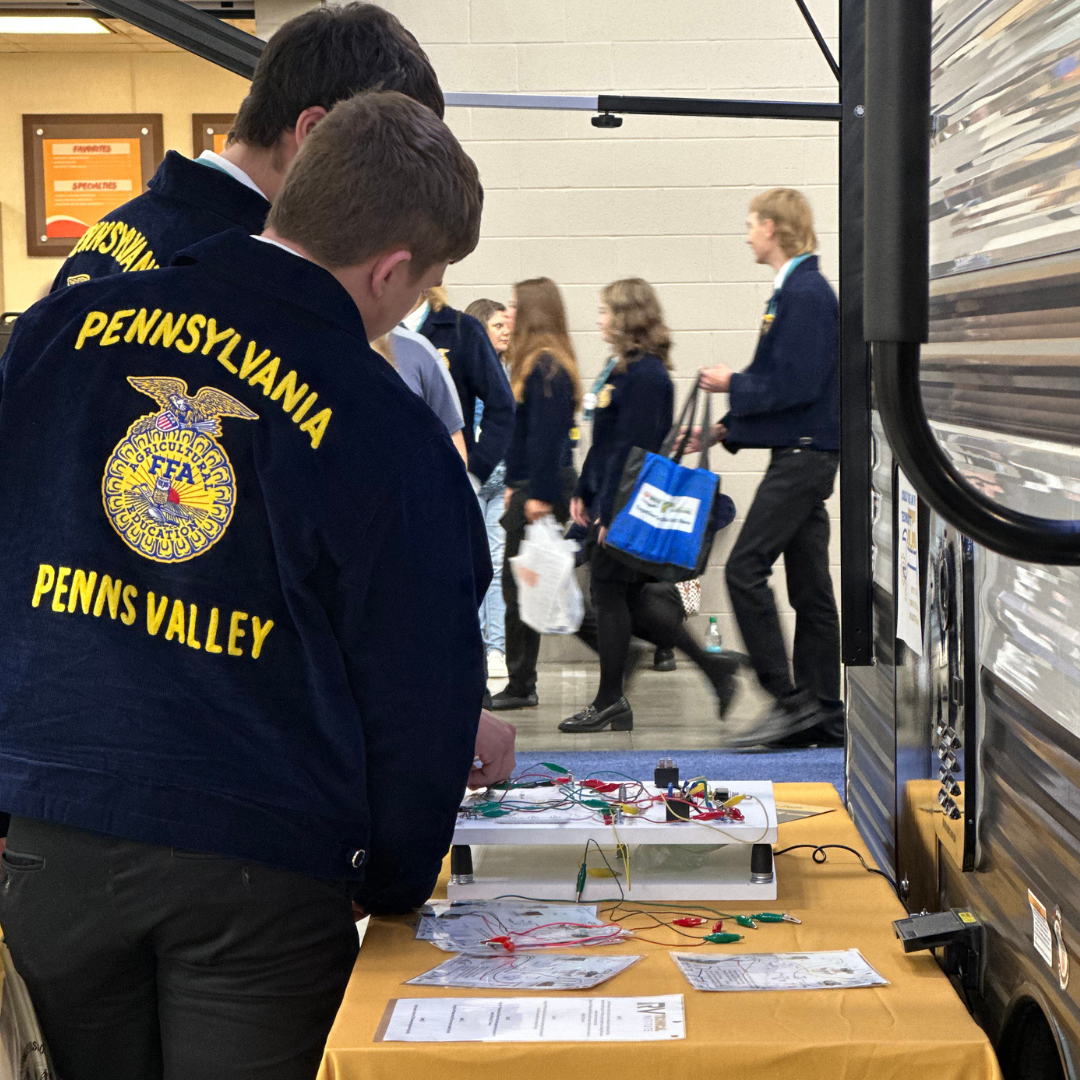 PA students look at electrical board 