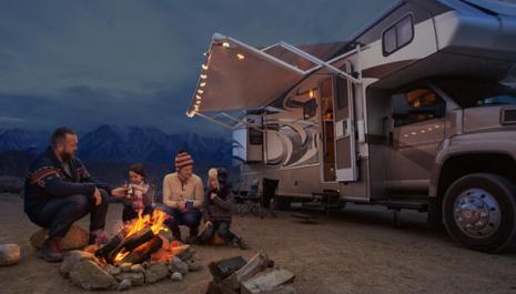 Family sitting at a campfire